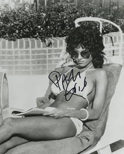 Pam Grier signed Foxy Brown photo: Pam Grier signed black and white 8x10 photo.