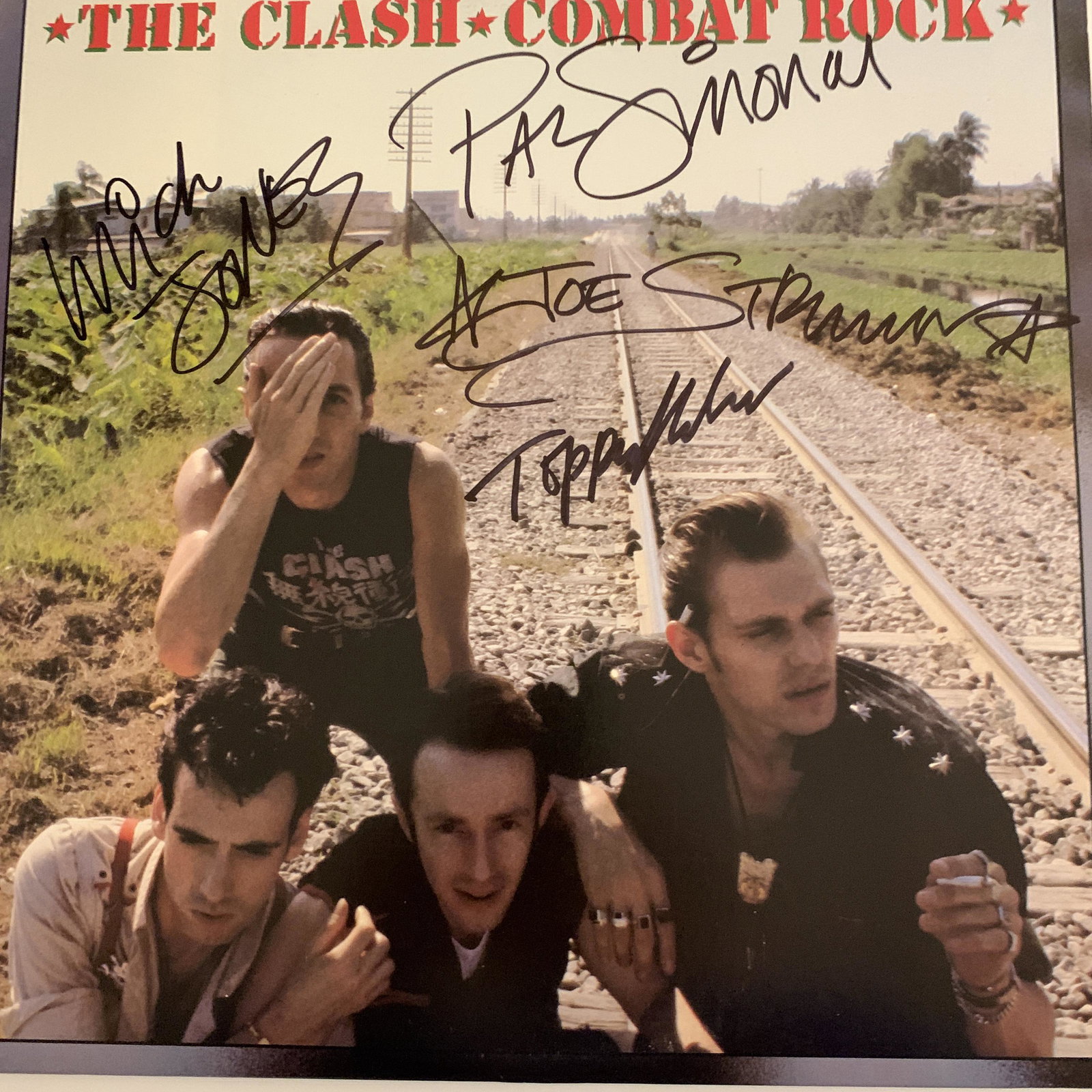 The Clash Combat Rock signed album: The Clash Combat Rock album signed by Joe Strummer, Mick Jones, Paul Simonon and Topper Headon