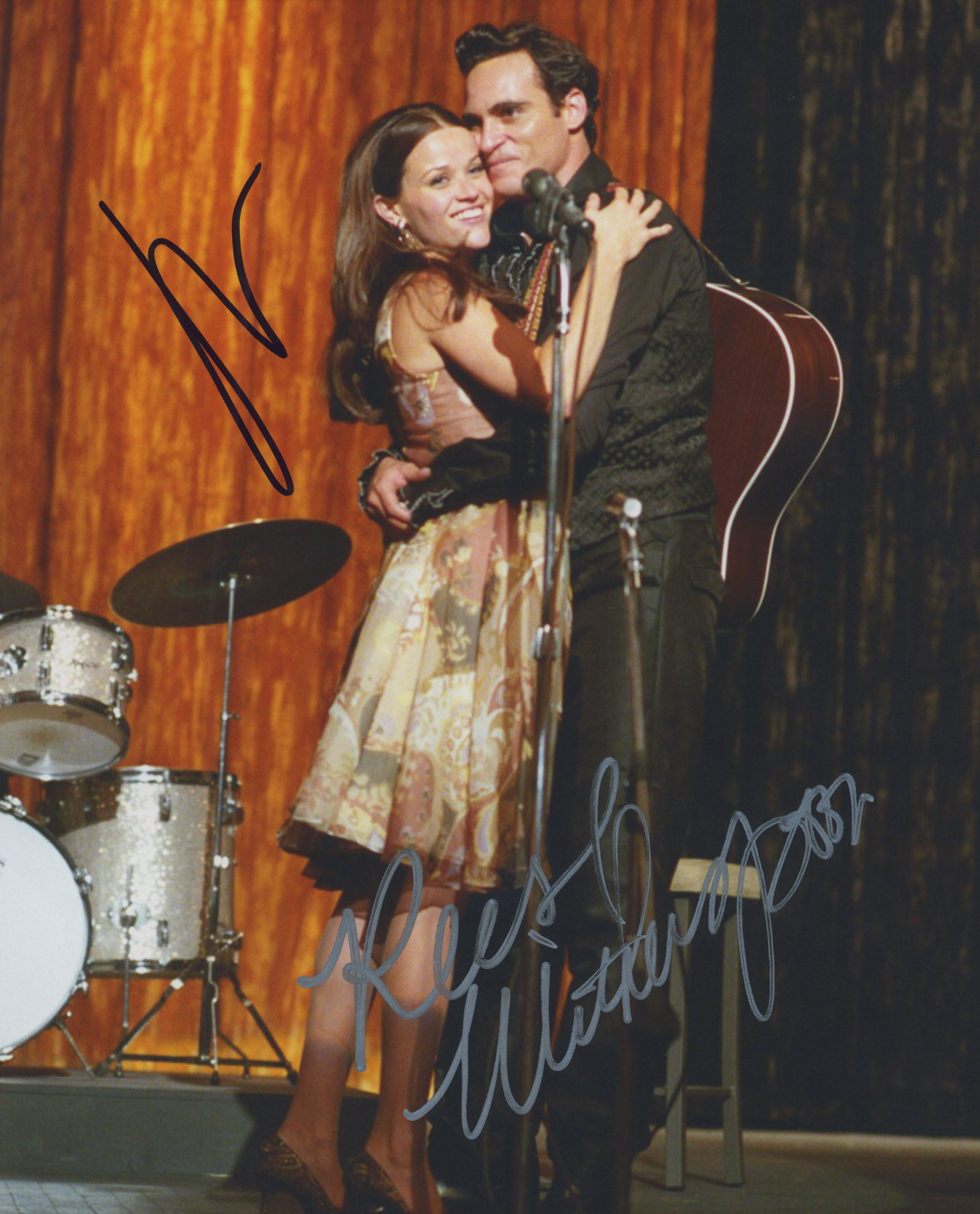 Walk the Line signed movie photo: Walk the Line signed movie photo autographed by Reese Witherspoon and Joaquin Phoenix. 8x10 inches