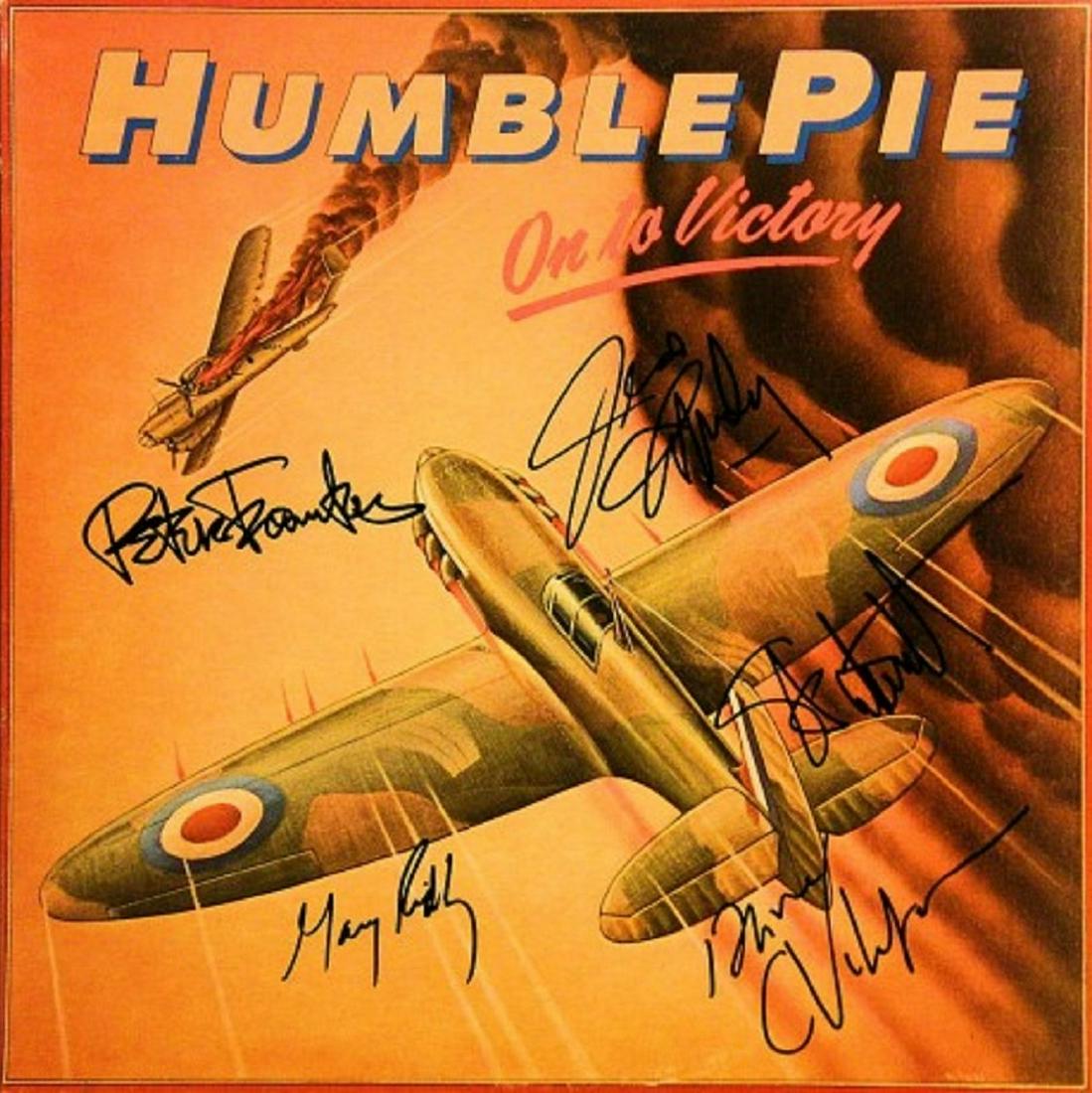 Humble Pie signed "Onto Victory" album: Humble Pie's 1980's hit album "Onto Victory" autographed by Peter Frampton, Steve Marriott, Greg Ridley, Jerry Shirley and Dave Clempson.