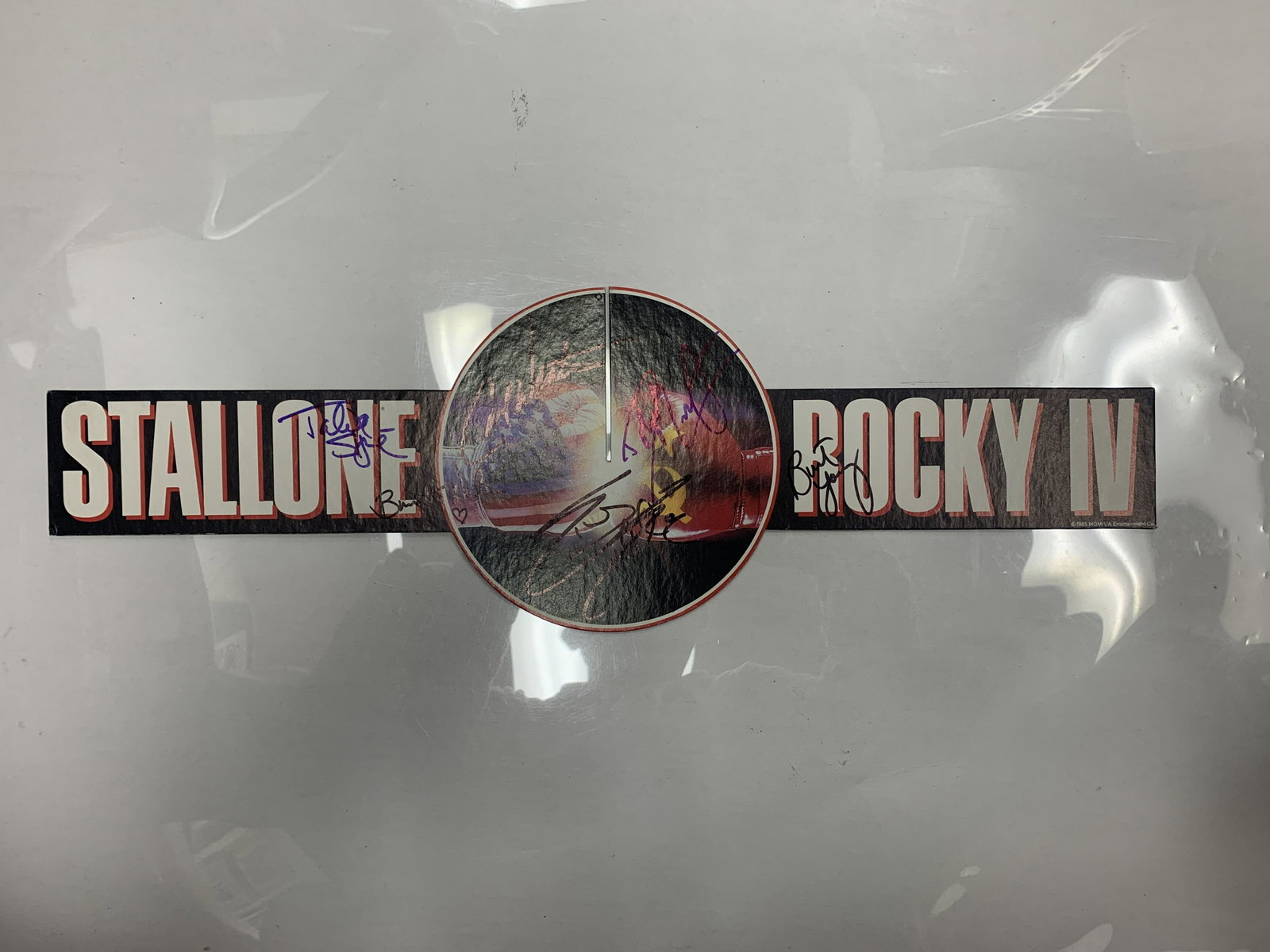 Rocky IV cast signed movie display: Rocky IV cast signed movie display autographed by Sylvester Stallone, Carl Weathers, Talia Shire, Dolph Lundgren, Burt Young and Brigitte Nielsen. 6x19 inches