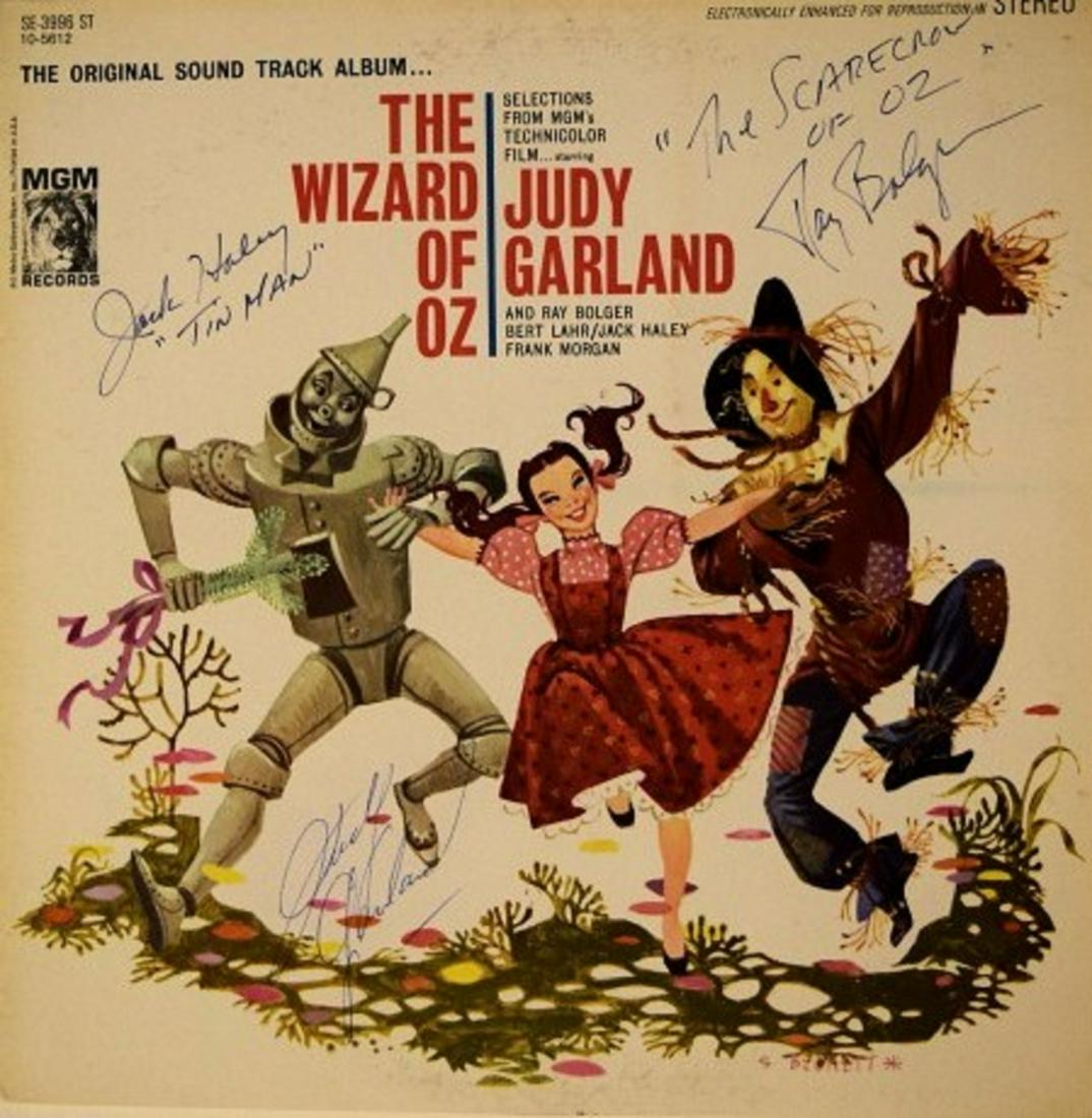 Signed Rare original "Wizard Of Oz" soundtrack album: Rare 1956 original music to the motion picture "Wizard Of Oz" album autographed by Judy Garland, "The Scarecrow Of Oz" Ray Bolger, and Jack Haley "Tin Man".
