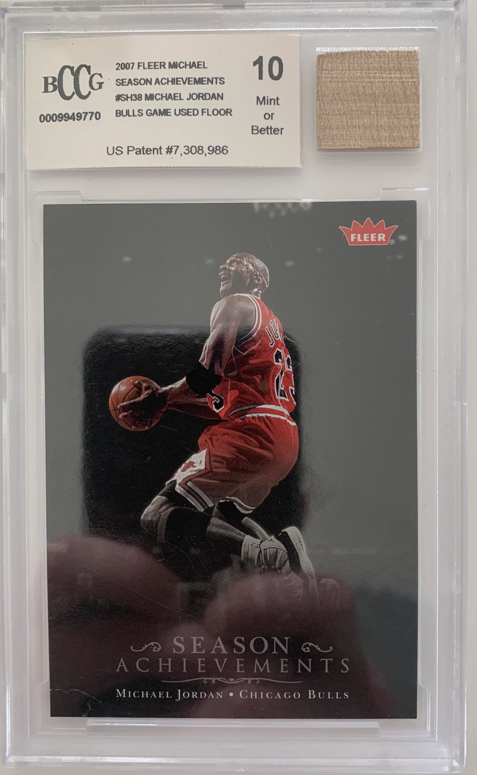 Michael Jordan basketball card and game used floor: Michael Jordan basketball card and game used floor swatch. Beckett greded 10. Unsigned