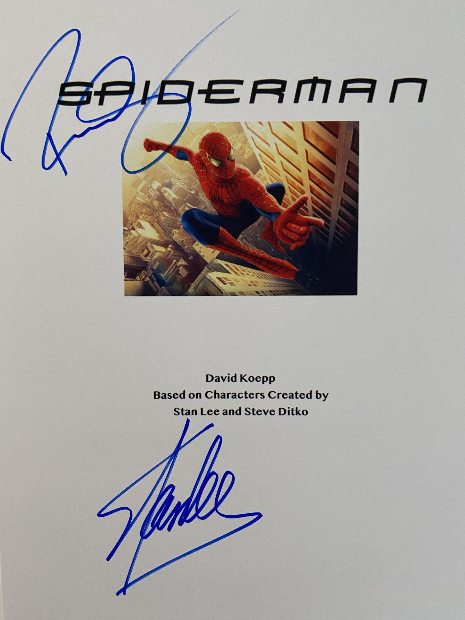 Stan Lee Spider-Man signed movie script cover photo: Spider-Man signed movie script cover photo autographed by Stan Lee and Tobey Maguire. 8x10 inches
