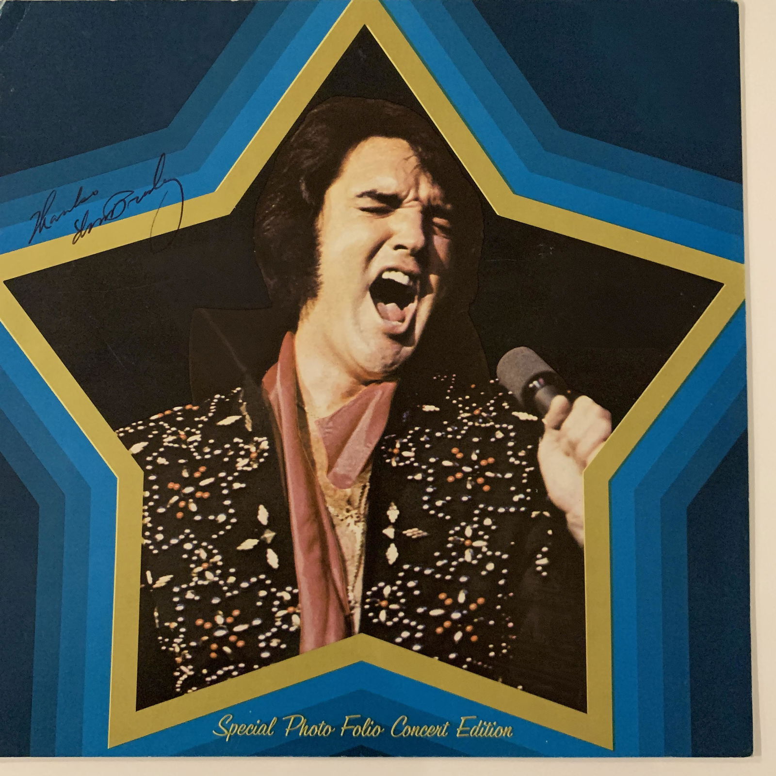 Elvis signed program: This is an Elvis Presley autographed concert photo folio special edition brochure. The inner pages depict different from Elvis Presleys Las Vegas 1972 engagement. This was a program they sold at the s