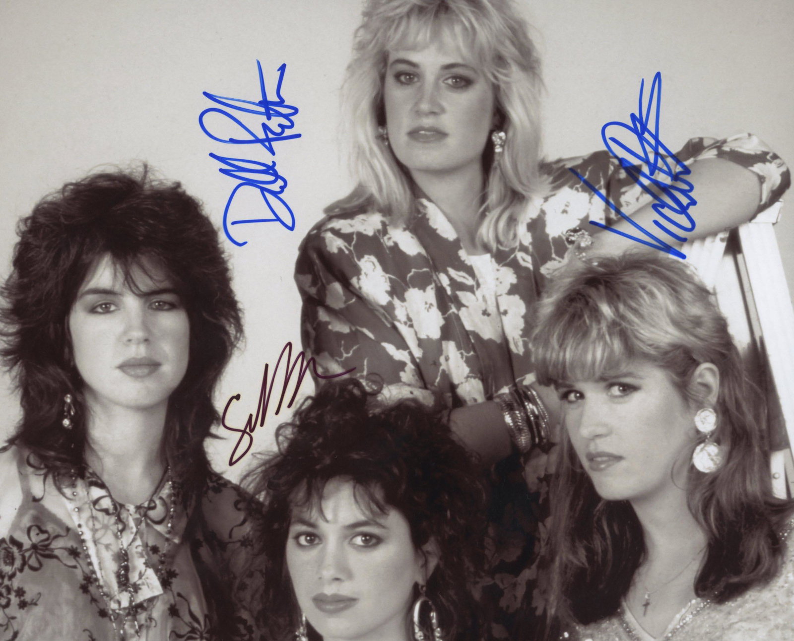The Bangles signed photo: The Bangles signed band photo autographed by Susanna Hoffs, Debbi Peterson and Vicki Peterson. 8x10 inches.