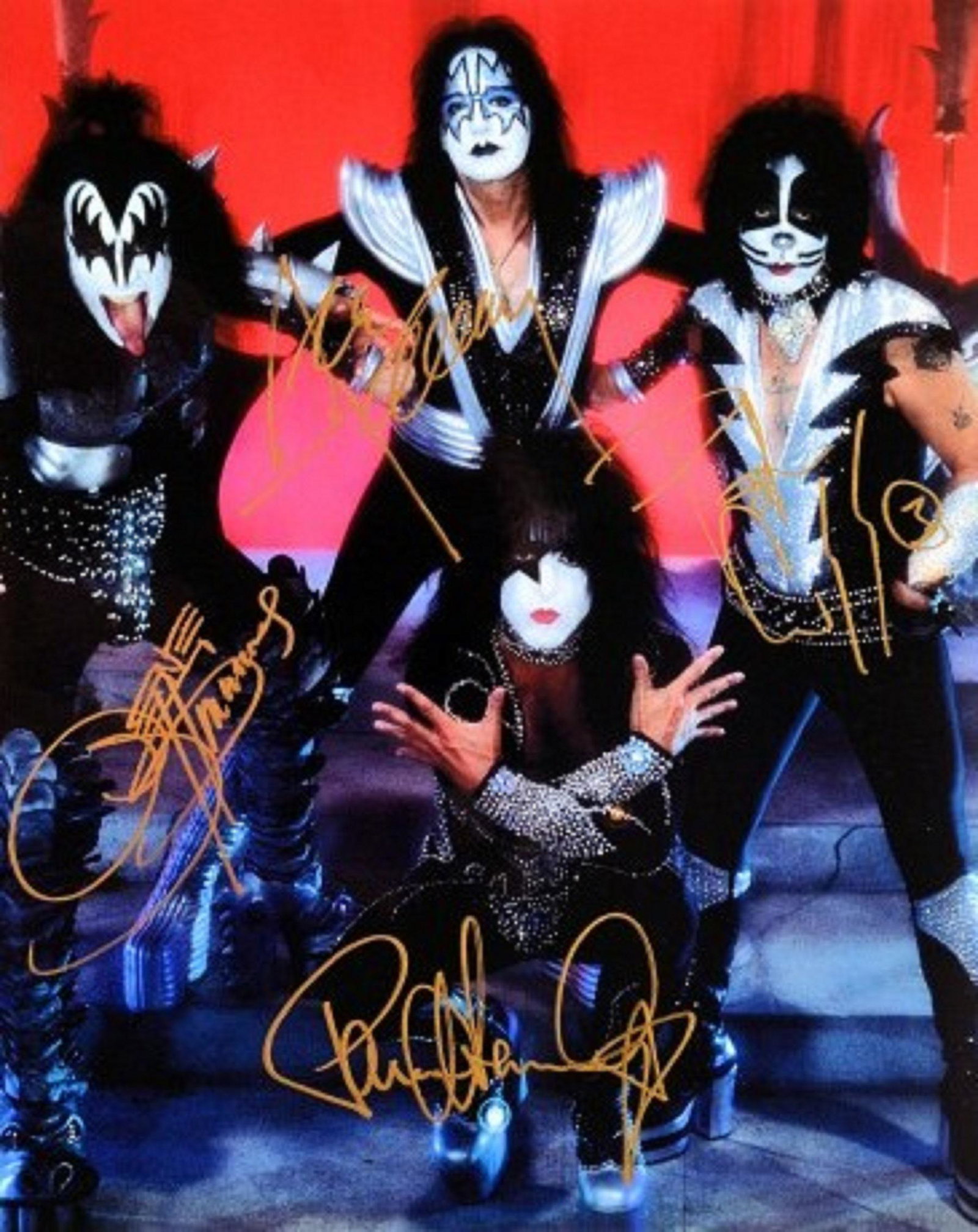 KISS signed promo photo: 8 in. by 10 in. KISS promotional photo autographed by Gene Simmons, Peter Criss, Ace Frehley, and Paul Stanley.