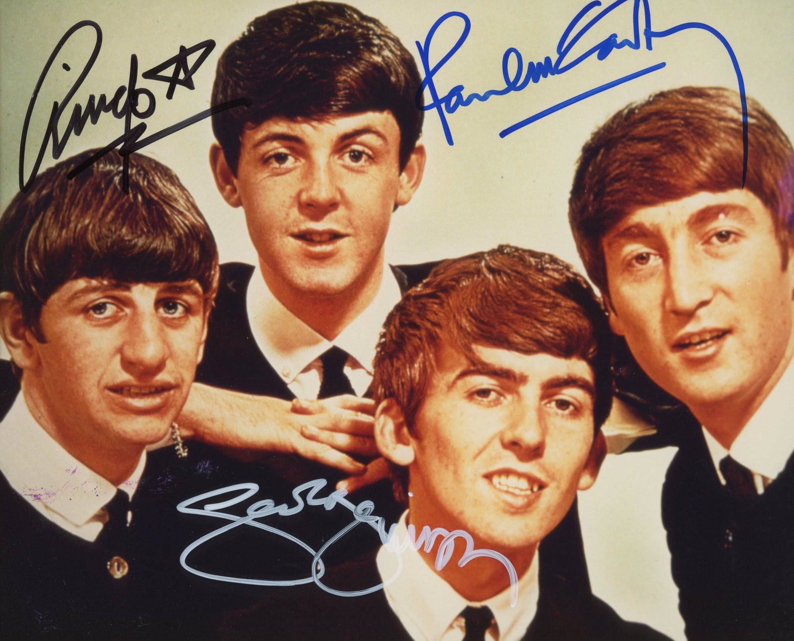 The Beatles signed vintage photo: The Beatles signed vintage photo autographed by Paul McCartney, George Harrison and Ringo Starr. Custom framed, matted 11x14 inches.