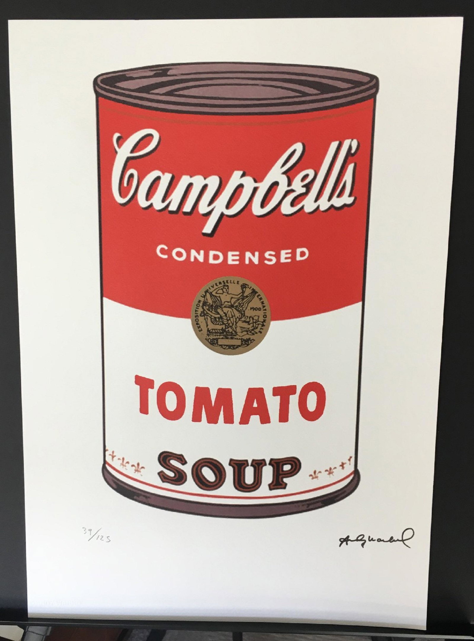 Andy Warhol Tomato Soup LE Lithograph: Limited edition 39 of 125 Campbell's Tomato soup Lithograph with Andy Warhol dry stamped (embossed) in the left corner of the paper with a black stamped signature in the right. Also, including a blue 
