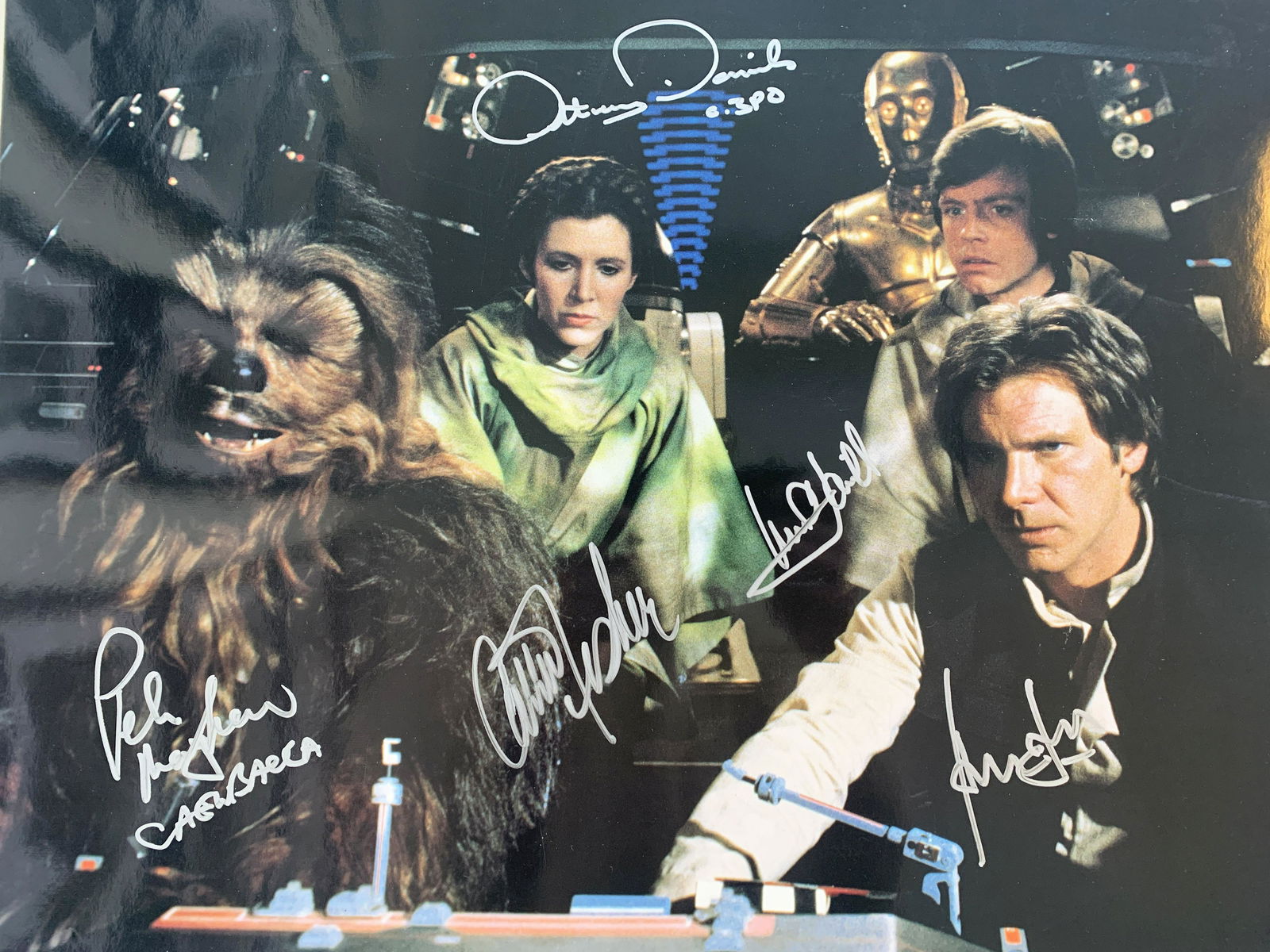 Star Wars cast signed original 1983 Return of the Jedi: Star Wars cast signed original 1983 Return of the Jedi movie photo autographed by Peter Mayhew, Anthony Daniels, Carrie Fisher, Harrison Ford and Mark Hamill. 16x20 inches