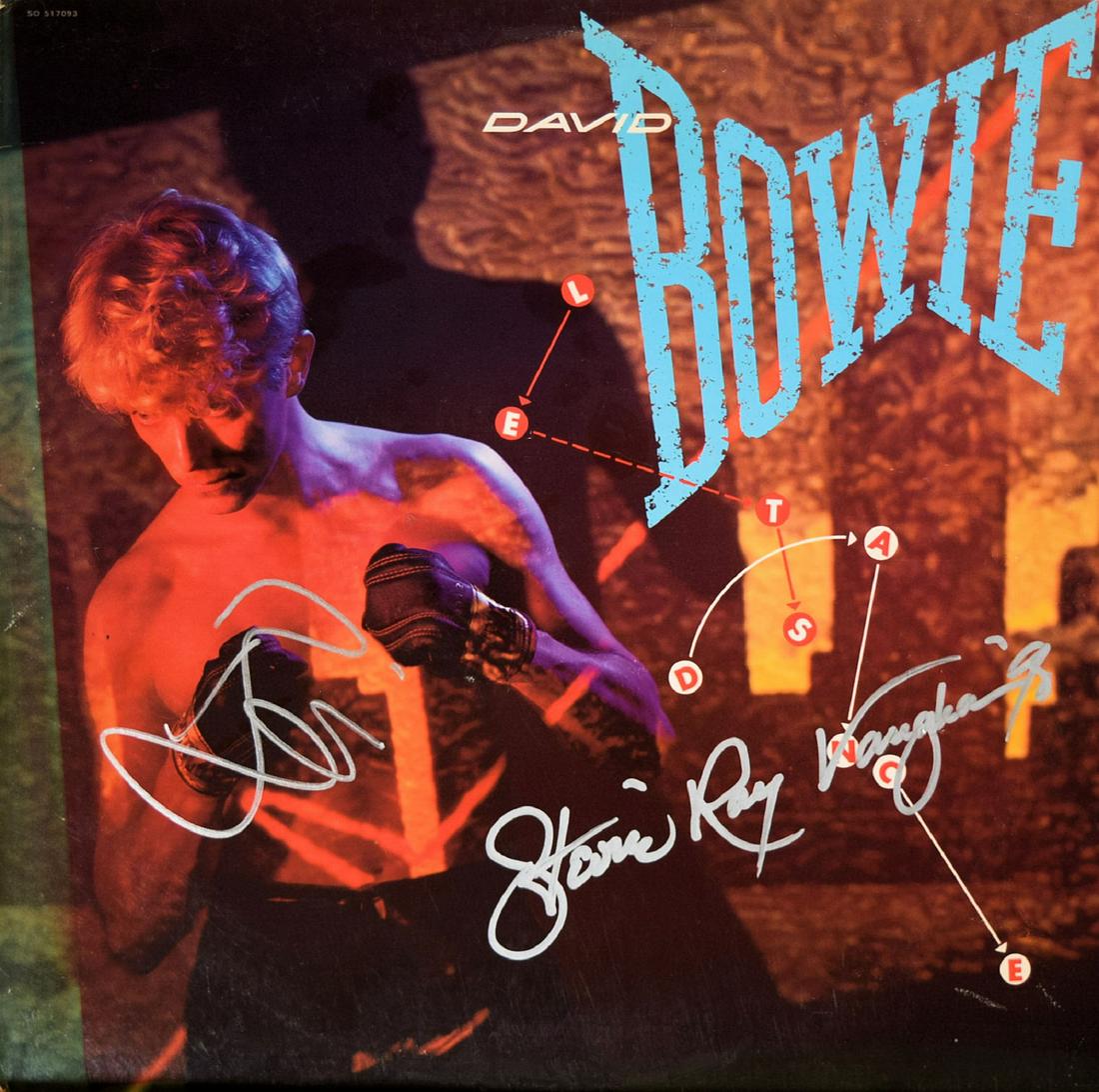 David Bowie & Stevie Ray Vaughan signed Letâ€™s Dance: 1983 Letâ€™s Dance album autographed as David Bowie & Stevie Ray Vaughanâ€™90
