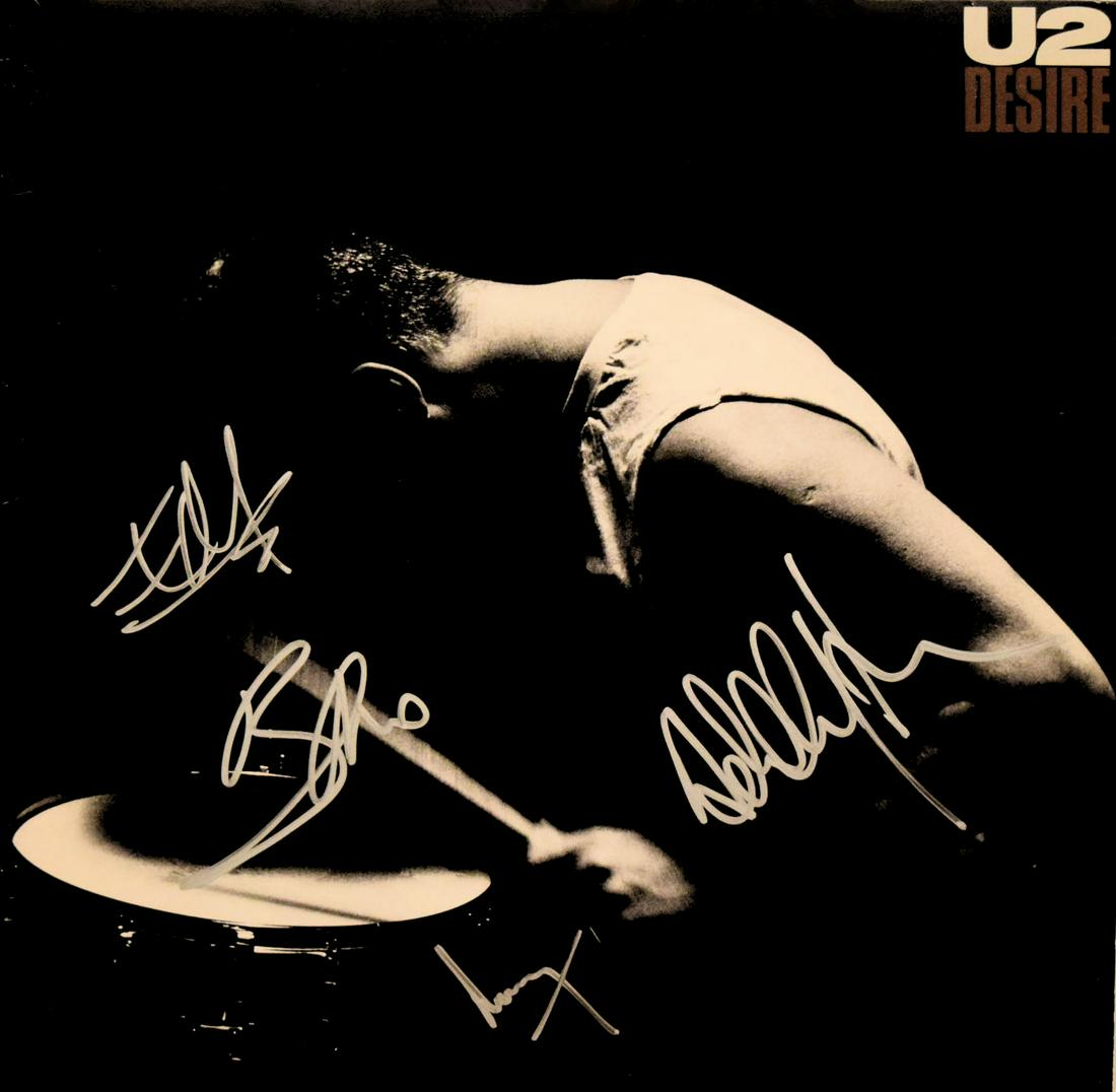 U2 signed Desire album: U2 1988 Desire This is the 12 Inch Single from the Album Rattle and Hum which includes the songs Desire and Hallelujah Here She Comes. Signed: Bono, The Edge, Adam Clayton, and Larry Mullen
