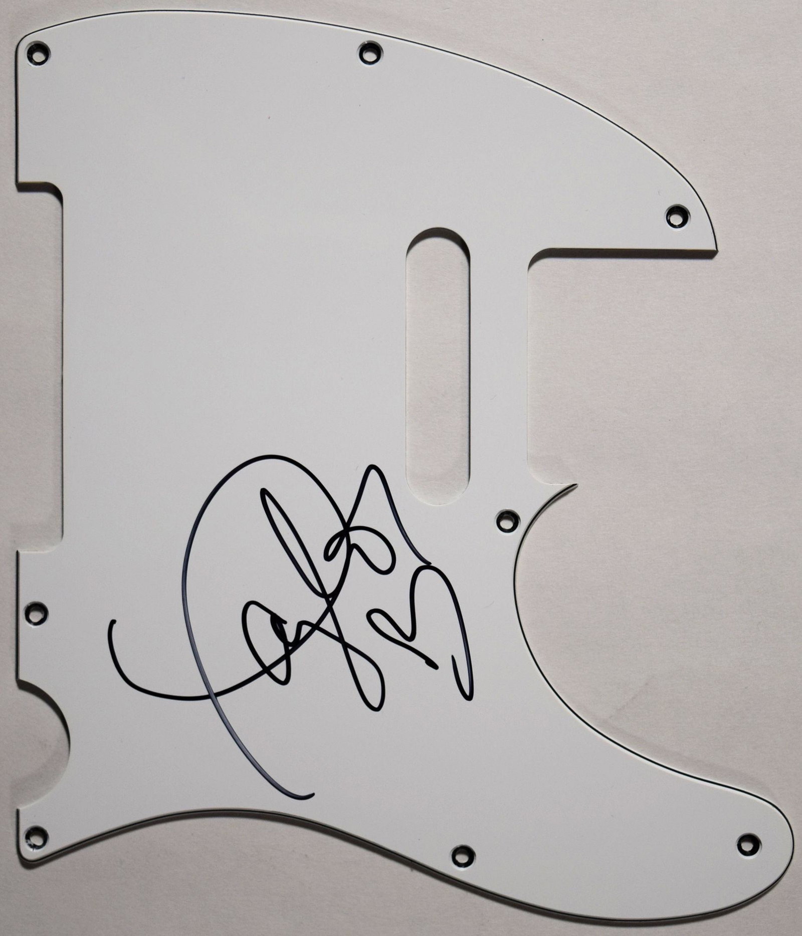Taylor Swift signed pickguard: White Telecaster Pick Guard which can be installed on a Fender Telecaster Electric Guitar. Signed: Taylor Swift