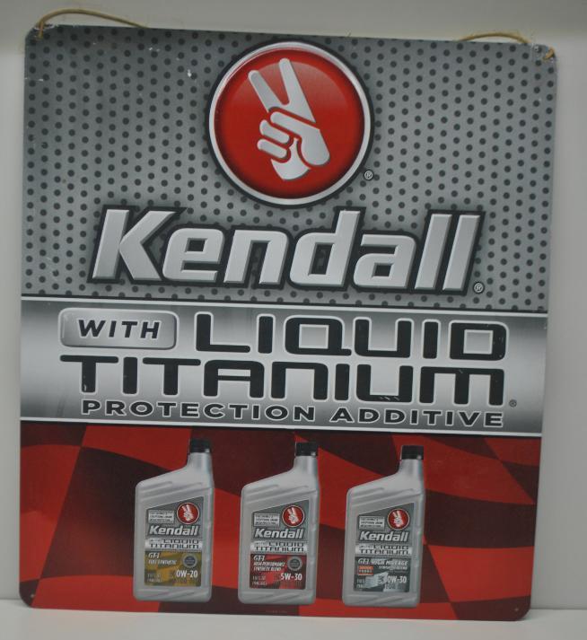 Kendall Liquid Titanium Motor Oil Sign: Single sided embossed metal sign in good condition with minor wear, size 20"x18"