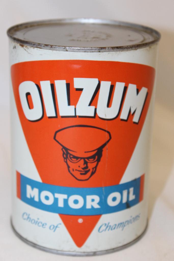Oilzum Metal 1 Quart Motor Oil Can: 5.5" x 4", has been drained by two holes in the top lid, in good condition with some light wear along the edges