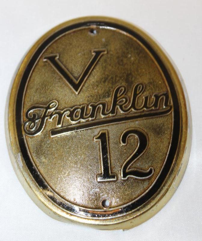 1933-1934 Franklin V12 Crank Hole Emblem Badge: there are two small holes added to the top and bottom, it appears to have been clear coated, 4" x 3.25"