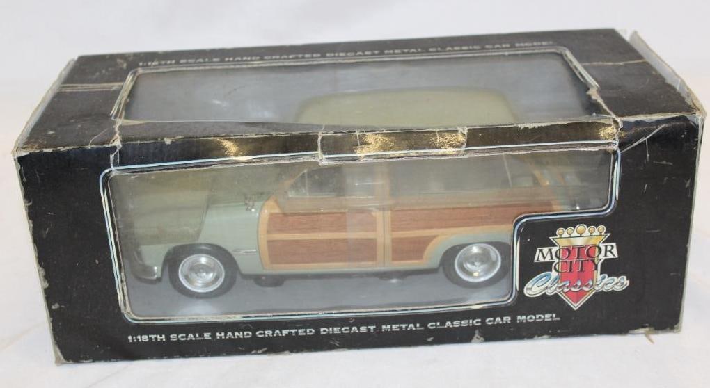 1949 Ford Woody Wagon Die Cast 1/18 Scale Car: 14" x 5" x 6.5", the box has been damaged but the car remains in excellent condition