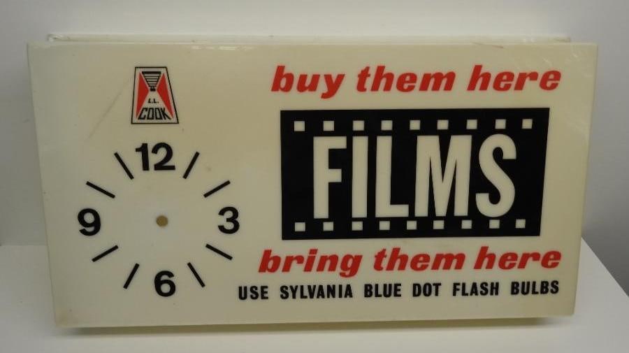 Sylvania Films Clock Face Sign: Plastic face for a clock, overall good condition with minor yellowing, size 11"x20"x3"