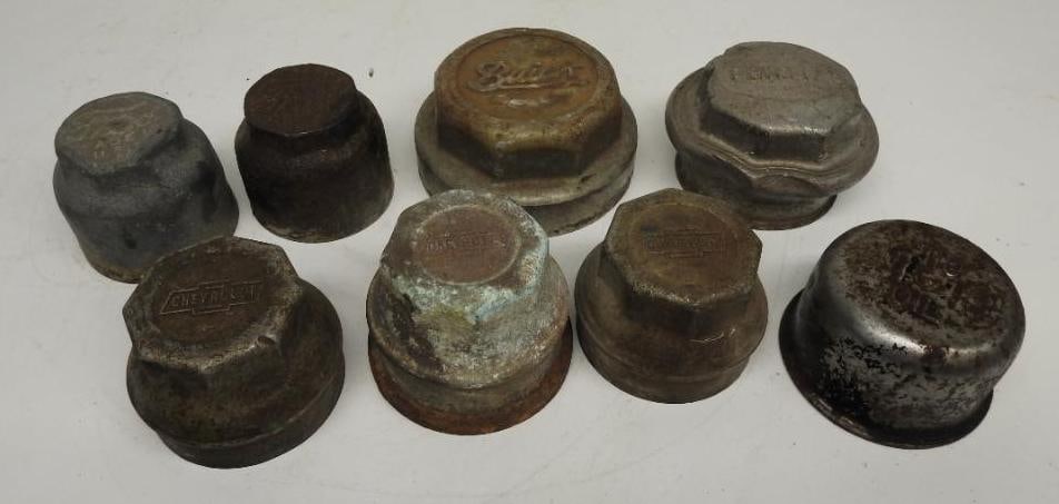Group of Automobile Hubcaps: Includes Ford, Chevrolet, Pontiac, and Hubcap, various sizes and conditions