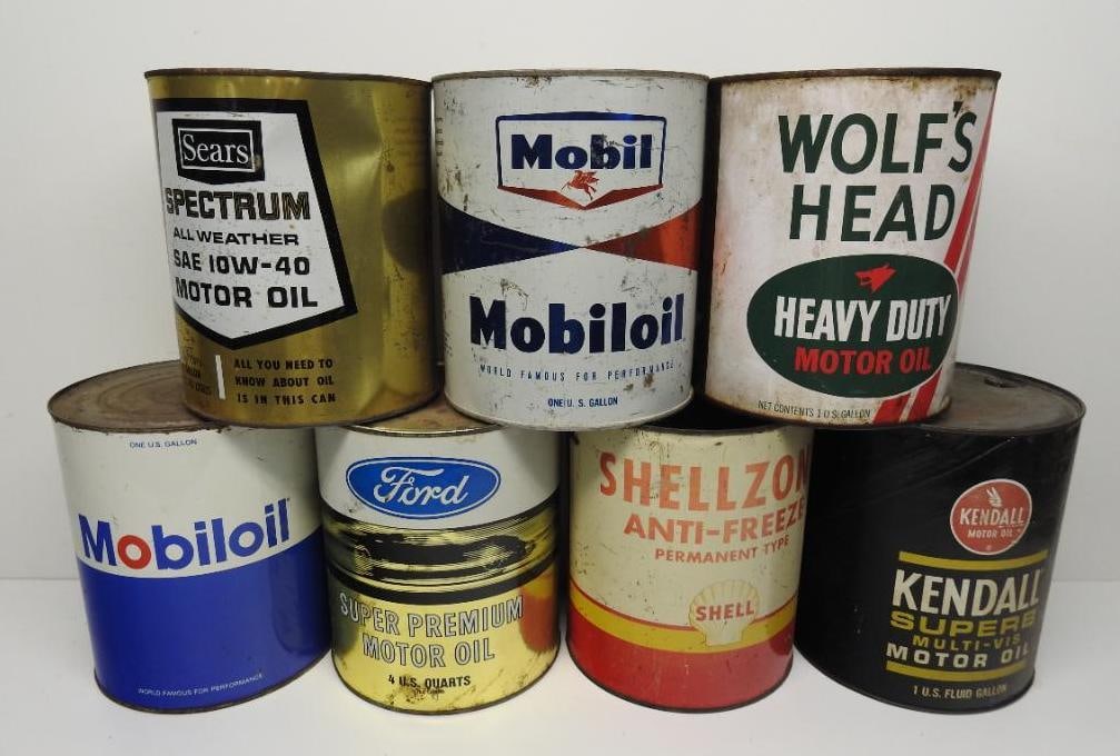 Group of Seven Assorted Gallon Oil and Anti-Freeze Cans: Includes Ford, Kendall, and others, all in fair to poor condition with some missing lids