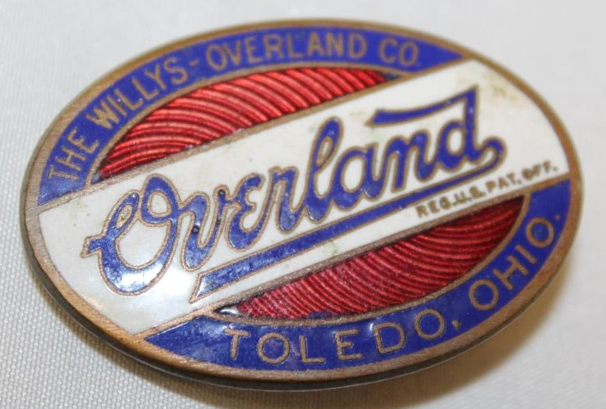 1919-1926 Willys Overland Radiator Emblem Badge: cloisonne, 2" x 1.25", this version has slight variation to the font
