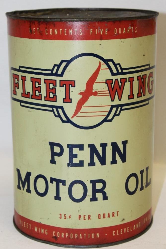 Fleet Wing Penn Metal 5 Quart Motor Oil Can: drained by two holes in the top lid, has some discoloration and a few dents throughout, 9.5" x 6.5"