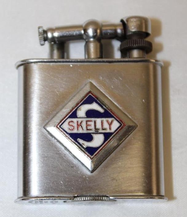 Skelly Oil Co Advertising Lighter: 2" x 1.75" x .5", the golden wheel lighter
