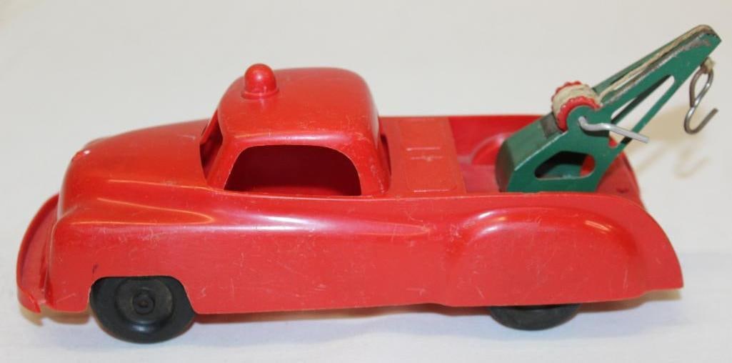 Processed Plastic Co Tow Truck Toy: 9.25" x 3.25" x 4.25", has light scratches throughout but appears to be very complete