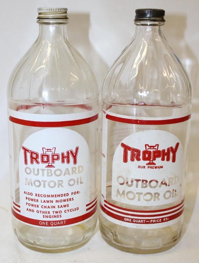 Group of 2 Trophy Outboard Glass Jars: largest 9" x 3.25", Pricer jar has staining on front label, both are empty with lid