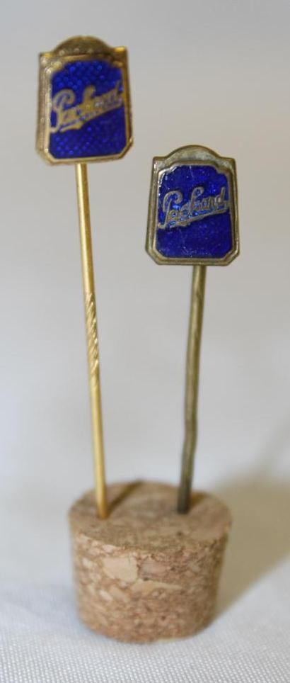Group of 2 Packard Motor Car Co Radiator Shaped Stick Pins: cloisonne, 2" x .25" each; One is original and the other appears to be modern