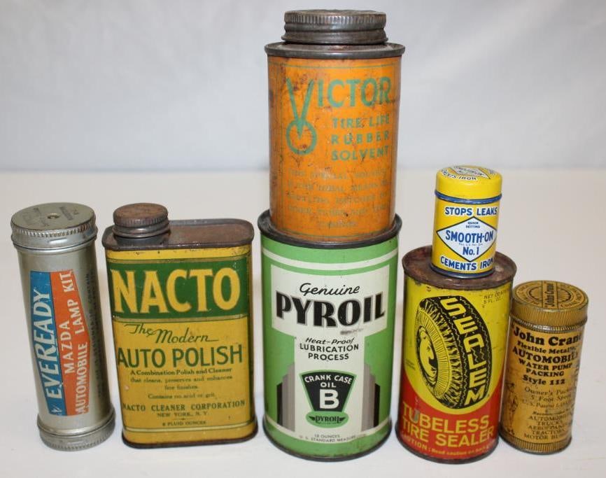 Group of 7 Automobile Related Advertising Cans: Largest is 2.75" x 4.5"