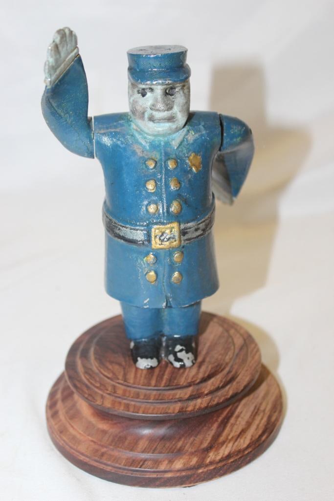 1920's Policeman Whirligig Radiator Mascot Hood Ornament: 7.5" x 4.5" x 4.5", mounted to wood base, the face has been repainted