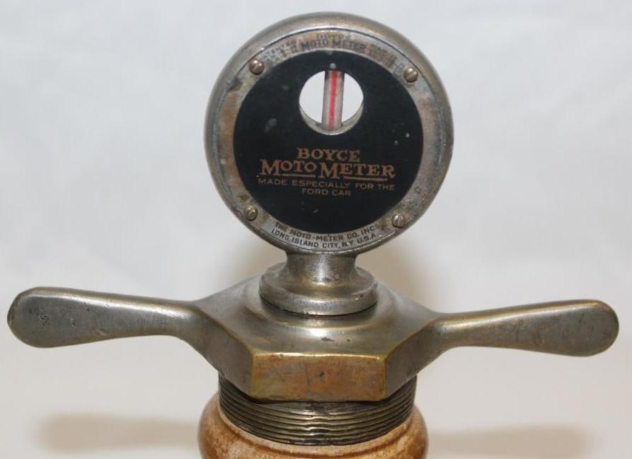 Early Boyce Moto Meter Radiator Mascot: 4" x 6" x 2", mounted to dog bone base