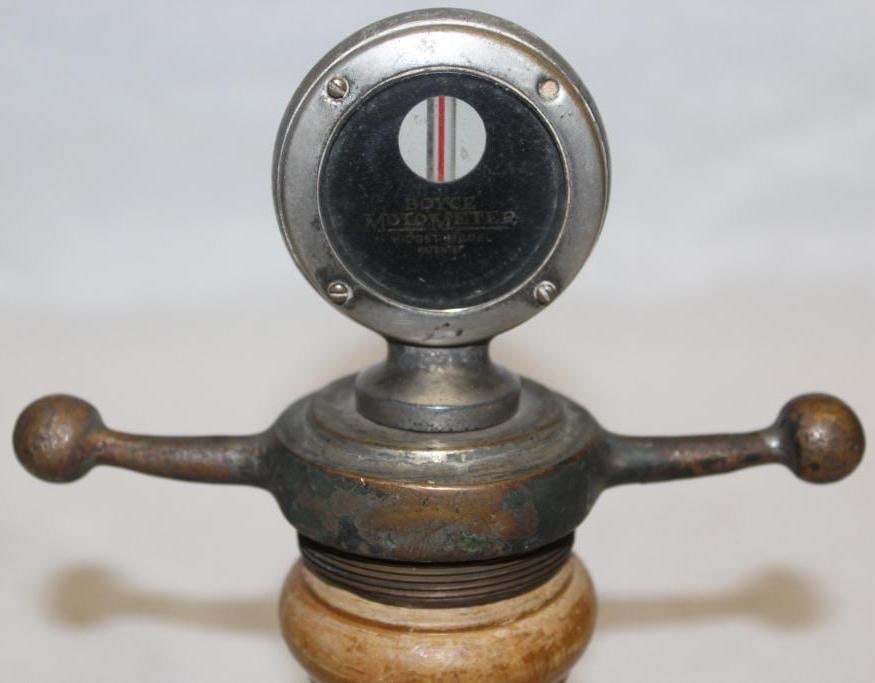 Boyce Moto Meter Radiator Cap Mascot: 6" x 4" x 2.25", mounted to dog bone base