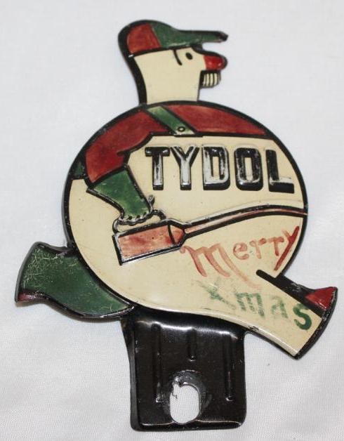 Red and Green Christmas Tydol Service Station Attendant License Plate Topper: it appears that the red and green colors were added to a white topper when it was new, 6.5" x 4.5", has light fading and wear