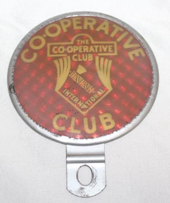 The Cooperative International Club Reflective License Plate Topper: 3" x 4.5"