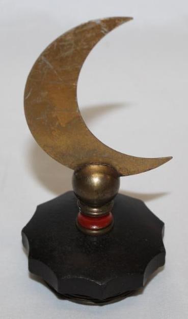 Crescent Moon Shaped Radiator Mascot Hood Ornament: 5.525" x 2.75" x 2.75", mounted to bakelite radiator cap