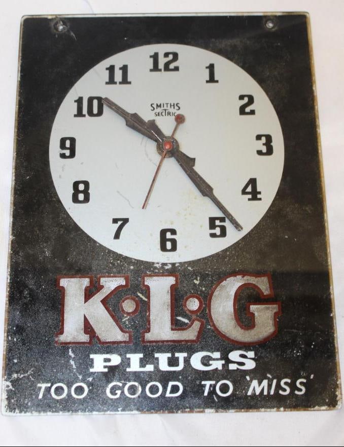 KLG Spark Plugs Glass Advertising Clock: It is missing the clock mechanism. It has a crack from the top left mounting hole. 10.5" x 14"