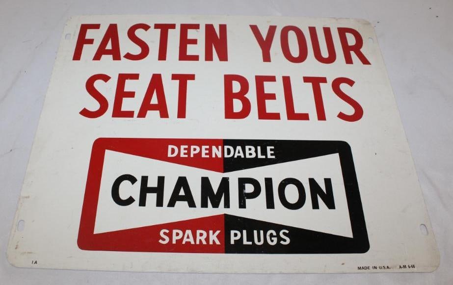 Champion Spark Plugs DST "Fasten Your Seatbelts" Advertising Sign: in good condition with only slight discoloration, marked AM 6-68, 14.5" x 17.5"