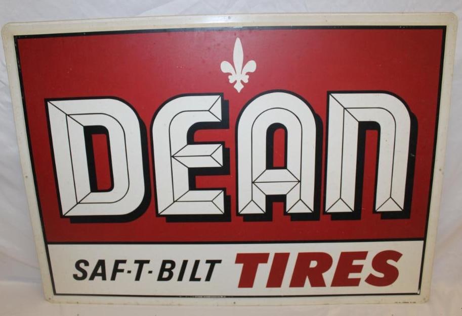Dean Saf-T-Blt Tires Advertising Metal Sign: 42" x 30". It is marked AM 10-64. It is in good condition with some slight staining and wear.