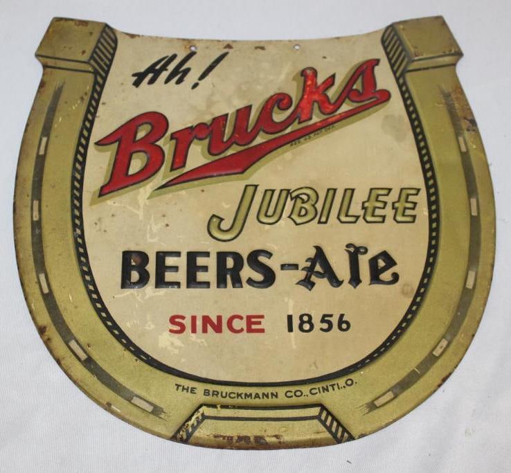 Cincinnati Bruckmann Beer Brucks Embossed Metal Advertising Sign: horseshoe shaped with some discoloration throughout and rust staining along the edges, has some touchup in the red, 11.5" x 11"