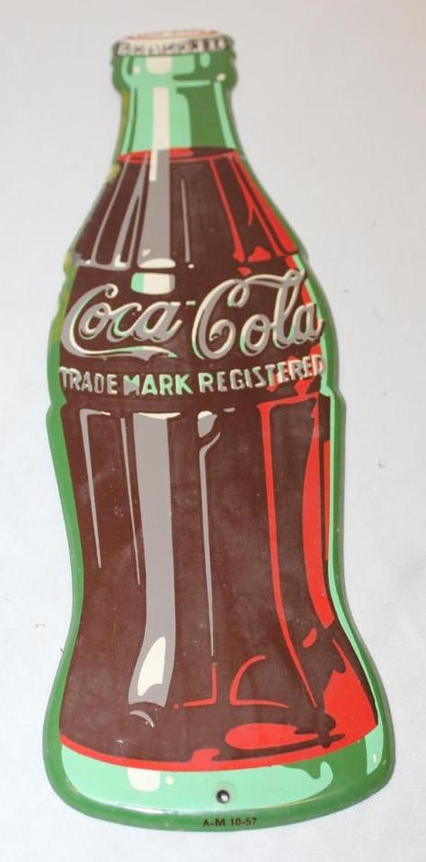 Coca-Cola Soda Die Cut Advertising Bottle Sign: embossed galvanized metal, 17" x 5", with light staining along the edges, marked AM 10-57