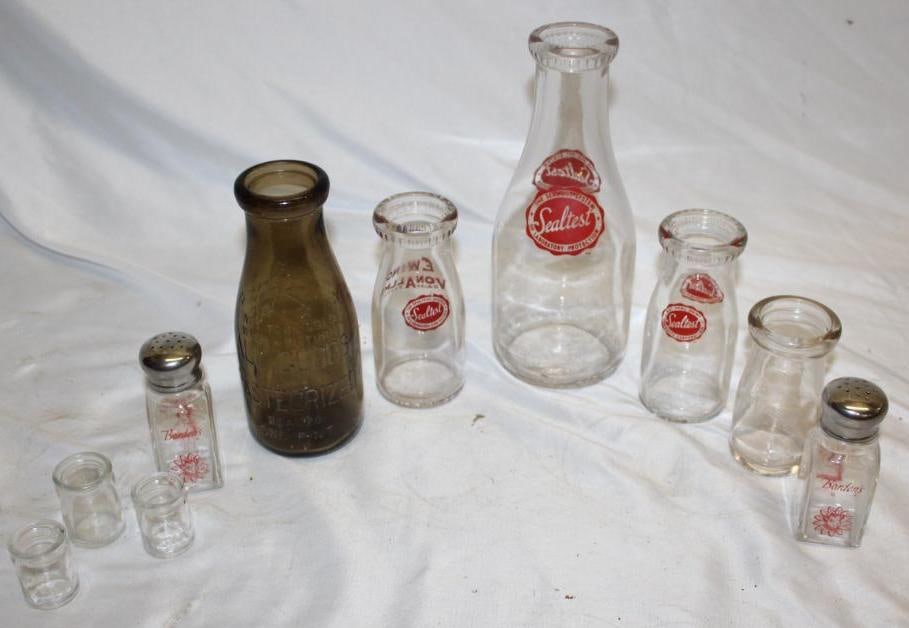 Group of 10 Advertising Milk Bottles; Bordens, Sealtest, All Goods: The Bordens is a salt and pepper set. The largest is a one quart bottle.