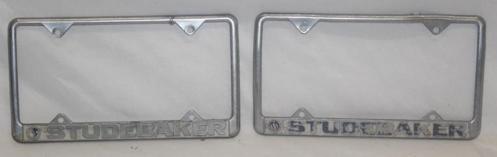 Group of 2 Studebaker Advertising License Plate Frames: 12.25" x 6.75"; Both have some paint loss