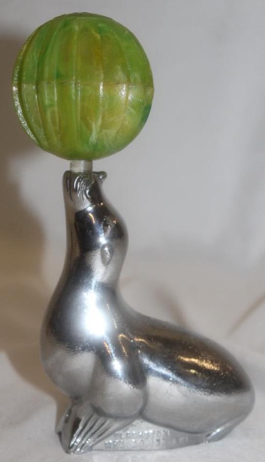 Seal w/ Light Up Ball Radiator Mascot Hood Ornament by Blackstone: 7" x 4.5" x 2", marked Blackstone