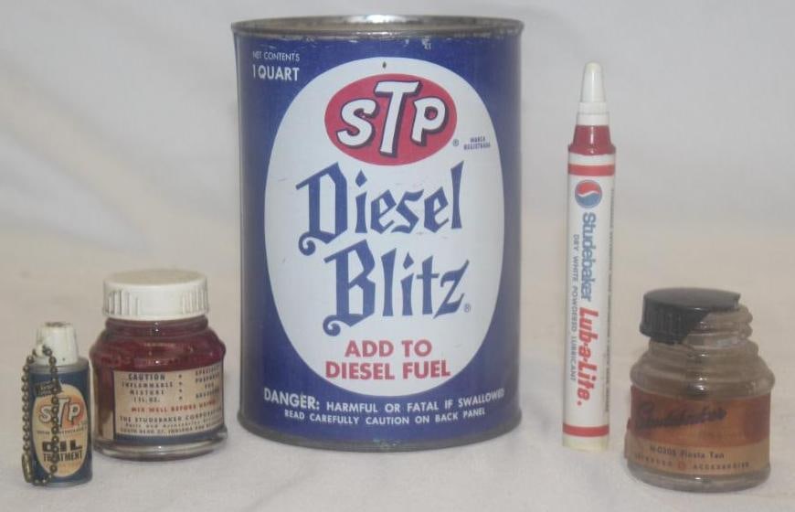 Group of 5 Studebaker and STP Products: Touch-Up Paint, Oiler, Key Chain Light, Diesel Blitz (Studebaker & STP. Largest is 1 quart.