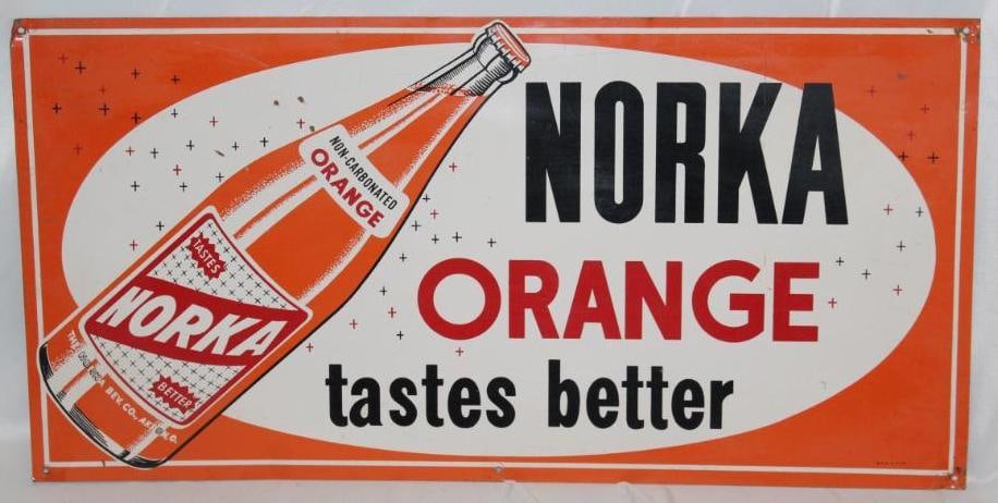 Norka Orange Embossed Soda Advertising Sign: It is marked MCA. It is in very nice condition with only minor wear. 24" x 12"