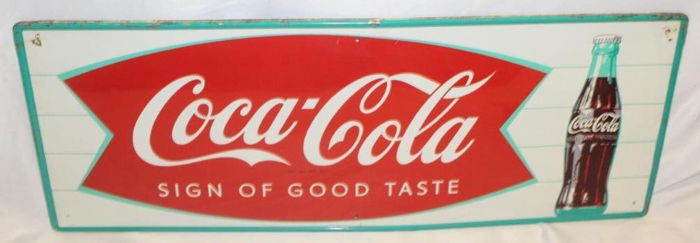 Coca-Cola "Sign of Good Taste" Fishtail Advertising Sign SST: It is single sided and marked MCA. It is in good condition with some minor scuffs and light wear around the mounting holes. 32" x 12"