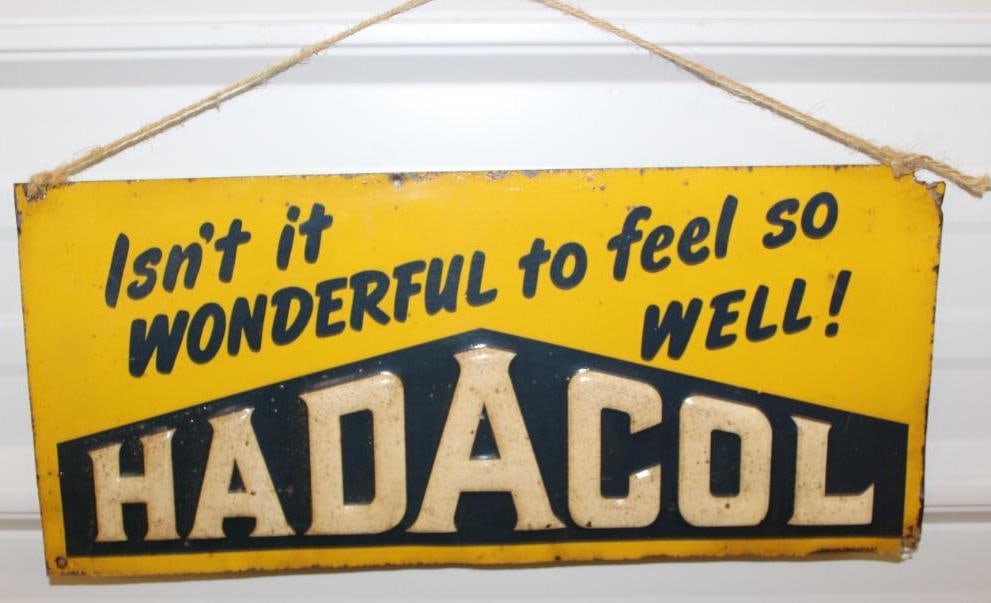 Hadacol Embossed Tin Advertising Sign: It is marked Stout Sign Co. It has been clear-coated and has some slight edge wear. 17.5" x 7.75"