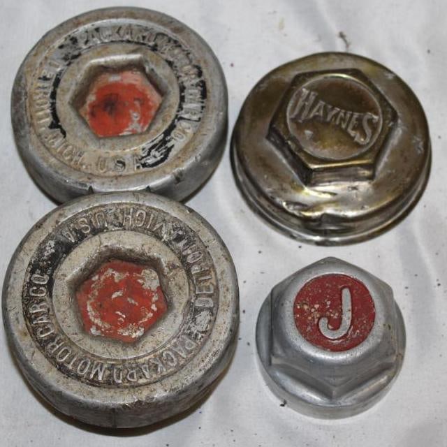 Group of 4 Threaded Automobile Hubcaps; Packard, Jewett, Haynes: The largest is 4" diameter
